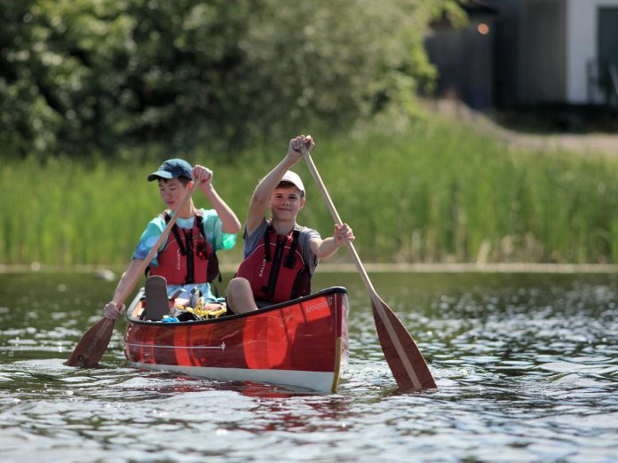 The Land Canadian Adventures' "Camp to Cottage" program can be personalized and customized to whatever the family wants and the kids like to do, including developing more confident paddling skills.  (Photo courtesy of The Land Canadian Adventures)