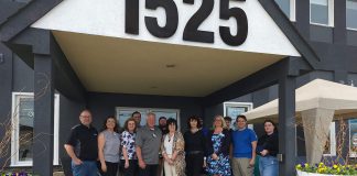 At The Lake Distributing owners Jason Pulchinski (front row, fourth from left) and Niki Pulchinski (front row, third from right) with their employees at their building at 1525 Chemong Road just outside Peterborough. As well as expanding their recreational water product wholesale distribution business thanks to a grant and support from Community Futures Peterborough, Jason and Niki have launched Shop The Lake, a patio furniture business also located in the building. (Photo courtesy of At The Lake Distributing)
