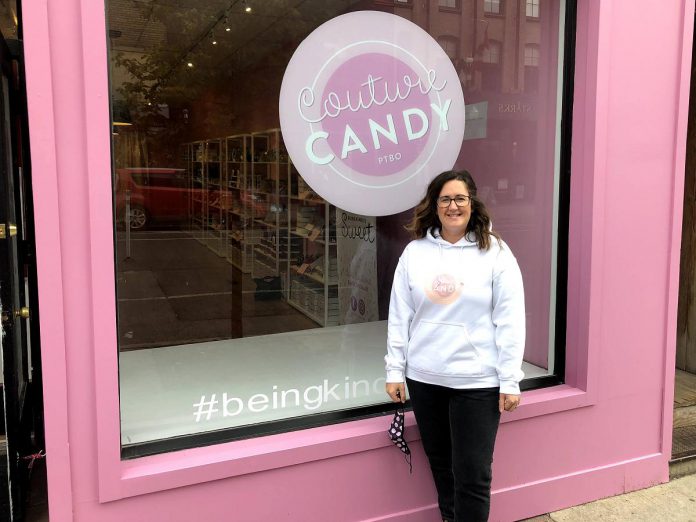 Couture Candy PTBO owner Lisa Couture stands outside her downtown Peterborough confectionery shop. She says the shop has a nostalgic appeal for customers, offering the same candy they remember from their childhood.  (Photo courtesy of Lisa Couture)