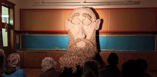 One of the many highlights of Public Energy Performing Arts' Erring at King George multi-arts festival is this spectacular sculpture of the head of English author and poet Edward Lear, which features in one of the four chapters of "The Lear Project" by actor-puppeteer Brad Brackenridge and dance-theatre artist Dreda Blow. The festival runs from May 6 to 8 and 13 to 15, 2022, at the former King George Public School in Peterborough's East City. (Photo: Bruce Head / kawarthaNOW)