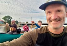 Guest columnist Paul Baines takes a selfie with other paddlers as they approach the mouth of the Trent River at the end of their 150-kilometre journey along the Trent-Severn Waterway. (Photo: Paul Baines)