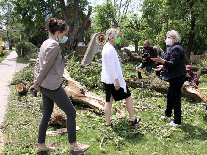 Ontario NDP leader Andrea Horwath (right) speaks with Peterborough mayor Diane Therrien and Peterborough-Kawartha NDP candidate Jen Deck as they survey some of the trees damaged at the Lions Centre in Peterborough's East City on May 25, 2022. (Photo: Jeannine Taylor / kawarthaNOW)