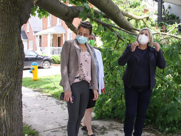 Ontario NDP leader Andrea Horwath (right), accompanied by Peterborough mayor Diane Therrien (left) and Peterborough-Kawartha NDP candidate Jen Deck, walked the block of Robinson, Burnham, Sophia and Mark Streets in Peterborough's East City on May 25, 2022 to to survey some of the damage caused by the devastating wind storm on the Victoria Day long weekend. (Photo: Jeannine Taylor / kawarthaNOW)