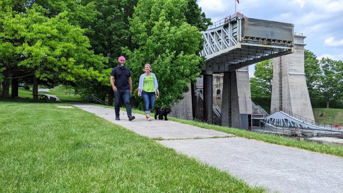 Federal NDP leader Jagmeet Singh with provincial Peterborough-Kawartha NDP candidate Jen Deck and her dog during a visit to Peterborough on May 31, 2022. (Photo: Bruce Head / kawarthaNOW)