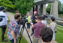 Federal NDP leader Jagmeet Singh, with provincial Peterborough-Kawartha NDP candidate Jen Deck beside him, answers questions during a media conference beside the Peterborough Lift Lock on May 31, 2022. (Photo: Jeannine Taylor / kawarthaNOW)