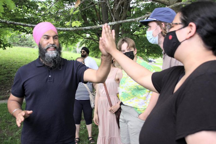 Federal NDP leader Jagmeet Singh gives a high five to a supporter beside the Peterborough Lift Lock on May 31, 2022. (Photo: Jeannine Taylor / kawarthaNOW)