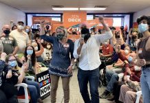 Ontario NDP candidate for Peterborough-Kawartha Jen Deck and federal NDP leader Jagmeet Singh cheer on supporters during Singh's visit to Deck's campaign office in downtown Peterborough on May 10, 2022. (Photo: Natalie Stephenson)