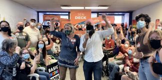 Ontario NDP candidate for Peterborough-Kawartha Jen Deck and federal NDP leader Jagmeet Singh cheer on supporters during Singh's visit to Deck's campaign office in downtown Peterborough on May 10, 2022. (Photo: Natalie Stephenson)