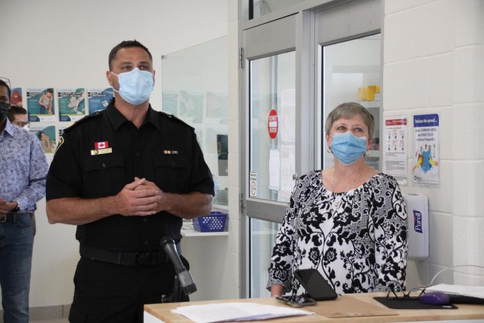 Peterborough City-County Paramedics commander Craig Jones and Fourcast executive director Donna Rogers listen to a question from local media during a tour of the new Consumption and Treatment Services site (CTS), located at the Opioid Response Hub at 220 Simcoe Street in downtown Peterborough, On May 27, 2002. (Photo: Jeannine Taylor / kawarthaNOW)