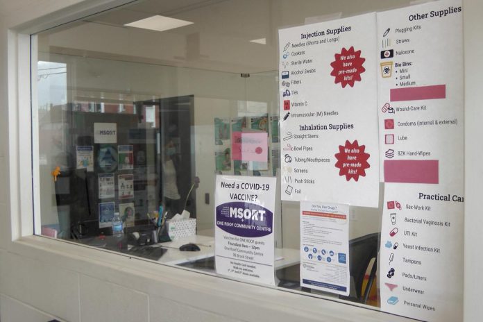 The entrance window to the Opioid Response Hub at 220 Simcoe Street in downtown Peterborough, where the CTS is located, displays some of the harm reduction supplies available to people who use drugs. (Photo: Bruce Head / kawarthaNOW)