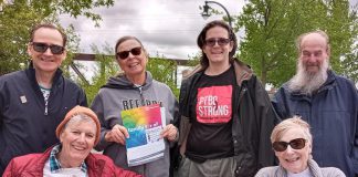 Members of the Peterborough chapter of Pflag, a national charitable organization founded by parents to help themselves and their family members understand and accept their LGBQIA2S children, gathered at the organization's rainbow bench in Millennium Park on May 17, 2022 to recognize International Day against Homophobia, Transphobia and Biphobia and to remember two past local leaders of the organization. (Photo courtesy of Pflag Peterborough)