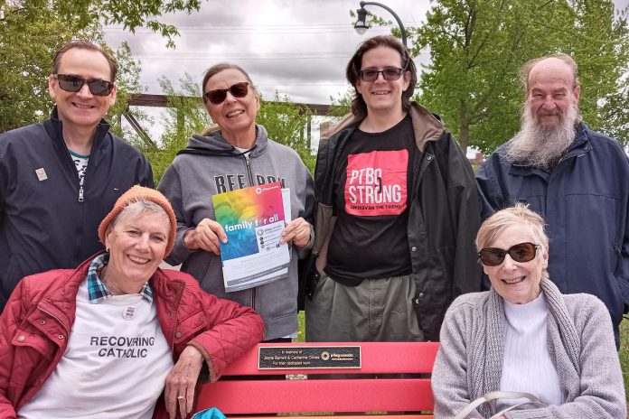 Members of the Peterborough chapter of Pflag, a national charitable organization founded by parents to help themselves and their family members understand and accept their LGBQIA2S children, gathered at the organization's rainbow bench in Millennium Park on May 17, 2022 to recognize International Day against Homophobia, Transphobia and Biphobia and to remember two past local leaders of the organization. (Photo courtesy of Pflag Peterborough)