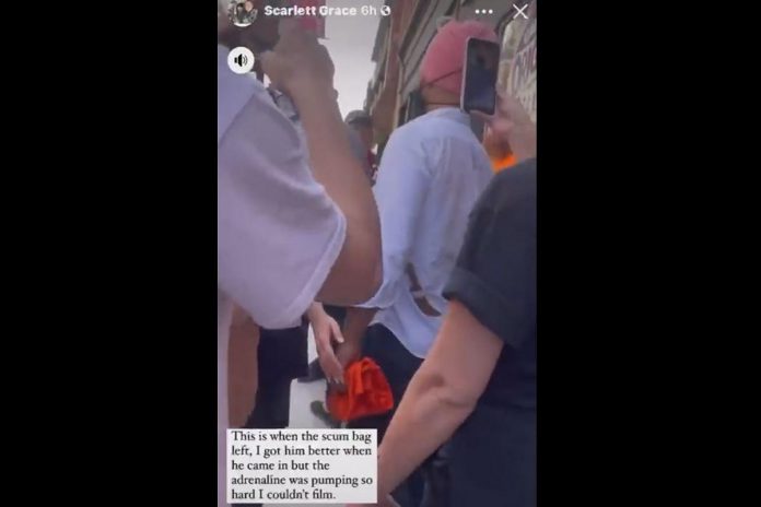 Protesters crowded around federal NDP leader Jagmeet Singh while screaming at him as he left provincial candidate Jen Deck's compaign office in Peterborough on May 10, 2022. The caption on the video refers to Singh as a "scum bag." (kawarthaNOW screenshot of Twitter video)