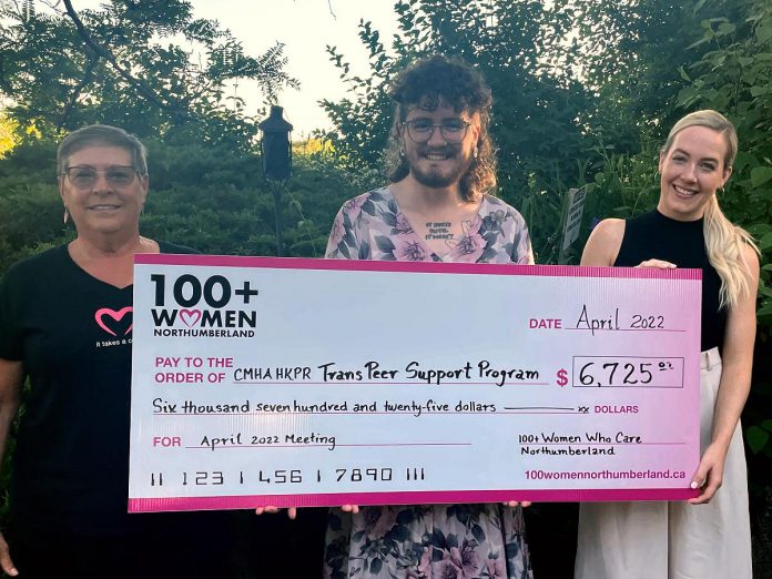 Carl Cruise-Baxter (middle), an outreach worker with the Canadian Mental Health Association Haliburton, Kawartha, Pine Ridge's Trans Peer Outreach program, accepts a donation of $6,725 from members of 100 Women of Northumberland. (Photo courtesy of CMHA HKPR)