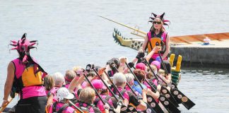 Paddlers at the 2015 Peterborough's Dragon Boat Festival, which returns to Del Crary Park in Peterborough on June 11, 2022 after a two-year absence because of the pandemic, raising funds for breast cancer screening, diagnosis, and treatment at Peterborough Regional Health Centre. (Photo: Linda McIlwain / kawarthaNOW)