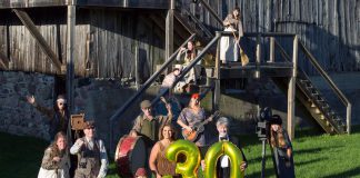 4th Line Theatre's managing artistic manager Kim Blackwell and founder and creative director Robert Winslow hold number balloons at Winslow Farm in a promotional photo for the Millbrook outdoor theatre company's 30th anniversary in 2022. (Photo: Wayne Eardley / Brookside Studio)