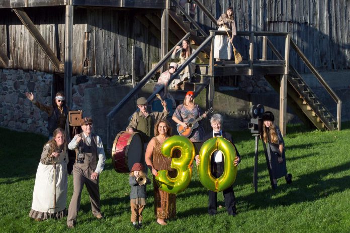 4th Line Theatre's managing artistic manager Kim Blackwell and founder and creative director Robert Winslow hold number balloons at Winslow Farm in a promotional photo for the Millbrook outdoor theatre company's 30th anniversary in 2022. (Photo: Wayne Eardley / Brookside Studio)