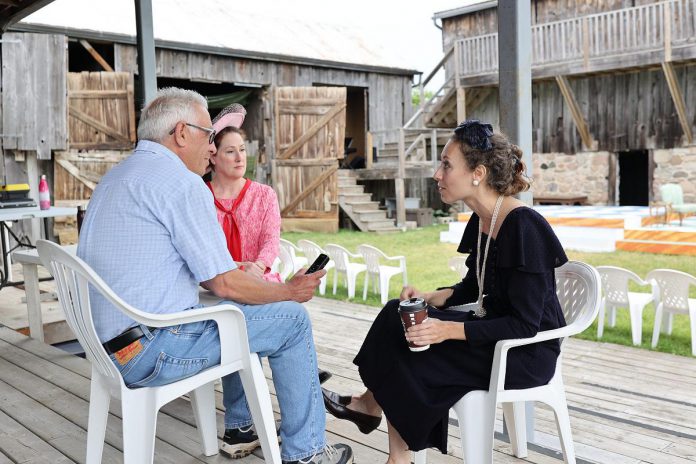 kawarthaNOW's Paul Rellinger interviews "The Great Shadow" actors Sochi Fried (right) and Shelley Simester during a media event at 4th Line Theatre's Winslow Farm in Millbrook on June 15, 2022. (Photo: Heather Doughty / kawarthaNOW)