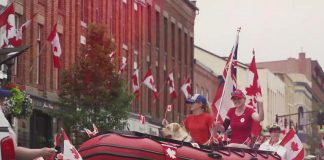A Canada Day parade in downtown Port Hope prior to the pandemic. (kawarthaNOW screenshot of Municipality of Port Hope video)