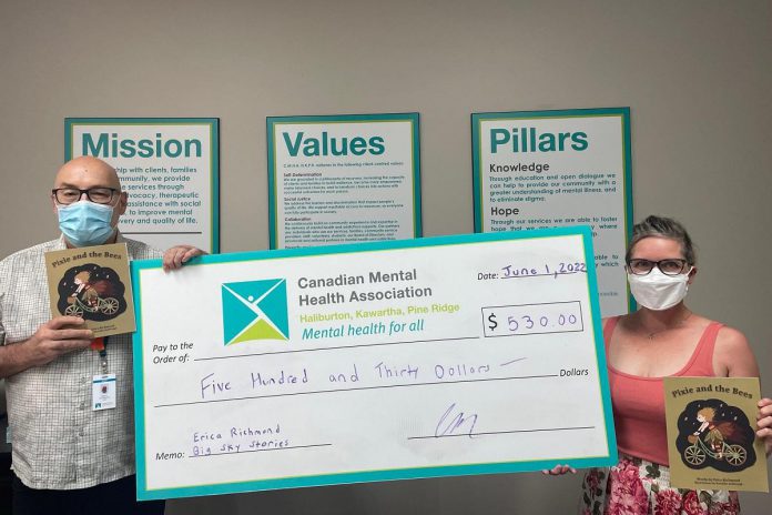 Peterborough writer Erica Richmond (right) with her $530 donation to the Canadian Mental Health Association, Haliburton, Kawartha, Pine Ridge. During May, Richmond announced she would donate half of the proceeds of her children's book 'Pixie and the Bees'. (Photo courtesy of CMHA HKPR)