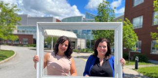 Michelle Finley, a district manager with Kawartha Credit Union, and Erin Coons, CEO of the Ross Memorial Hospital Foundation, in front of the Lindsay hospital. (Photo courtesy of RMH Foundation)