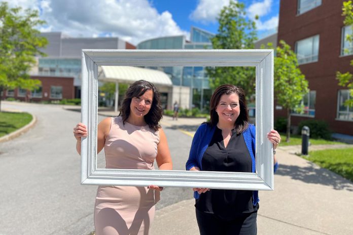 Michelle Finley, a district manager with Kawartha Credit Union, and Erin Coons, CEO of the Ross Memorial Hospital Foundation, in front of the Lindsay hospital. (Photo courtesy of RMH Foundation)