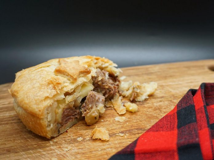 One of Kia Ora Pie Co.'s most popular pies is this steak and cheese pie, made with a thick onion gravy, old cheddar cheese, and tender mouthfuls of braised steak. (Photo: Kia Ora Pie Co.)