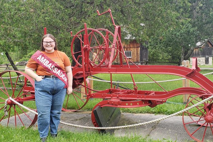 Grade 11 student Chloe Shaw, the 2022 Smoke & Steam Show Ambassador, at Lang Pioneer Village Museum in Keene. Chloe will be assisting the museum with various duties during the Father's Day Smoke & Steam Show on Sunday, June 19th.  (Photo courtesy of Lang Pioneer Village Museum)