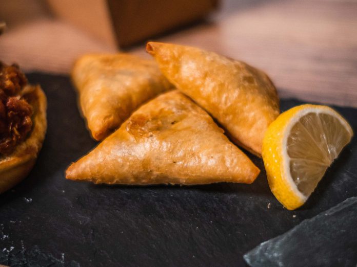 Indian-American fusion restaurant Dirty Burger will be offering up samples of their famous samosas, made with a spiced potato and vegetable filling and served up with a spicy mango chutney, on Saturday, June 25th. (Photo courtesy of Dirty Burger)