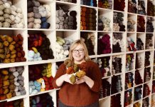Owner Deanna Guttman pictured in 2019 in front of her wall of yarn at Needles in the Hay in downtown Peterborough, one of seven yarn shops participating in this year's Cottage Country Yarn Crawl running from June 11 to September 6, 2022. (Photo: Amy E. LeClair)