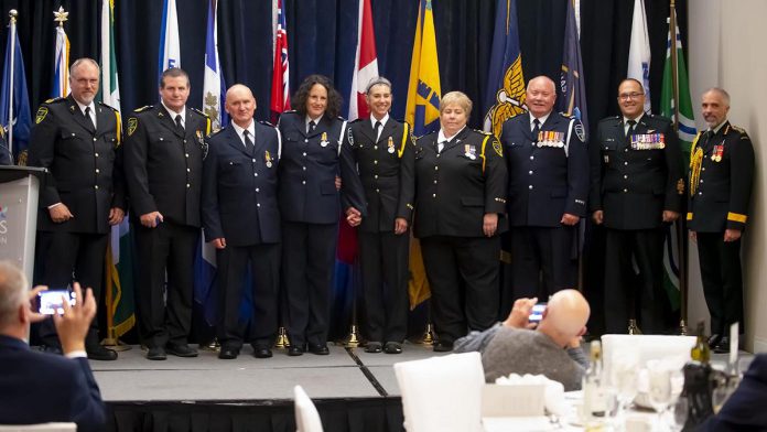 Left to right: Northumberland Paramedics deputy chief of quality improvement & professional standards Gord Nevils, Northumberland Paramedics deputy chief of operations Keith Barrett, Northumberland Paramedics paramedic Dan Dulmage, Northumberland Paramedics paramedic Heidi Brown, Northumberland Paramedics paramedic Angie Morrison, Northumberland Paramedics chief Susan Brown, Northumberland Paramedics paramedic Bob Cranley, Canadian Armed Forces chief warrant officer Martin Bedard, and Canadian Armed Force surgeon general major-general Marc Bilodeau. (Photo courtesy of Northumberland County)