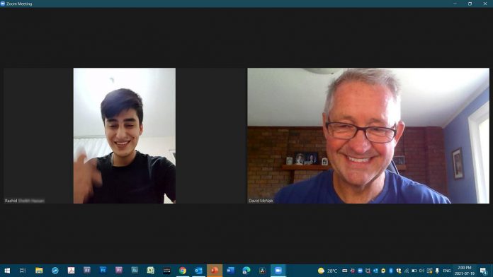 Retired OPP constable Dave McNab (right) conducts an online English lesson with Rashid in July 2021. He connected with the Syrian refugee two months earlier, after the teenager had posted a desperate plea in a Facebook group about coming to Canada and was subjected to abuse, including racism. (Photo courtesy of Dave McNab)