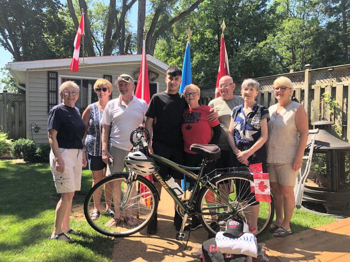 One of Rashid's sponsors, Lee-Anne Quinn (beside Rashid) and her family presented the Syrian refugee, who will celebrate his 19th birthday on July 27, with a bicycle and other welcome gifts. On Canada Day, Rashid will join Lee-Anne, a nurse who has served on peacekeeping missions as a Blue Beret, for an unveiling of a new UN peacekeeping-related monument in Peterborough. (Photo courtesy of Dave McNab)