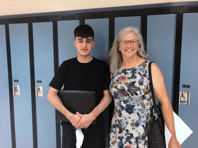 Sponsor Kristy Hiltz taking Rashid on a tour of Thomas A. Stewart Secondary School in Peterborough. He will be starting high school in September, with his ambition to attend university to study architecture or engineering. (Photo courtesy of Dave McNab)