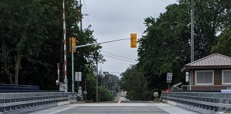 Parks Canada will be repairing selected grating panels of the metal deck of the Warsaw Road swing bridge in Peterborough from July 4 to 8, 2022 to reduce the noise caused by vehicles using the bridge. (Photo: Bruce Head / kawarthaNOW)