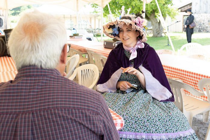 Megan Murphy, who plays Constance Small in 4th Line Theatre's production of "Wishful Seeing," speaks with kawarthaNOW's Paul Rellinger during a media event for the play at 4th Line Theatre's Winslow Farm in Millbrook on July 20, 2022. (Photo: Heather Doughty / kawarthaNOW)