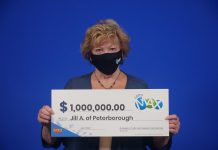 Jill Artibello with her $1 million Lotto Max prize. (Photo courtesy of OLG)