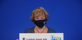 Jill Artibello with her $1 million Lotto Max prize. (Photo courtesy of OLG)