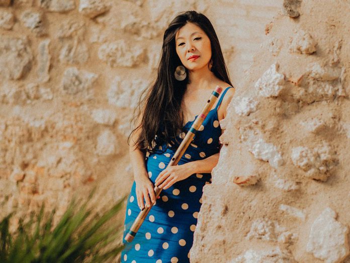 Canadian flamenco flutist Lara Wong, now living in Spain, is performing with her trio at the Gordon Best Theatre in downtown Peterborough on July 8, 2022. The Vancouver native, who performs on flute as well as bansuri (Indian bamboo flute, pictured) is the first foreigner and the first woman to ever win Spain's prestigious "Filon Minero" award for best flamenco instrumentalist. (Photo courtesy of Lara Wong)