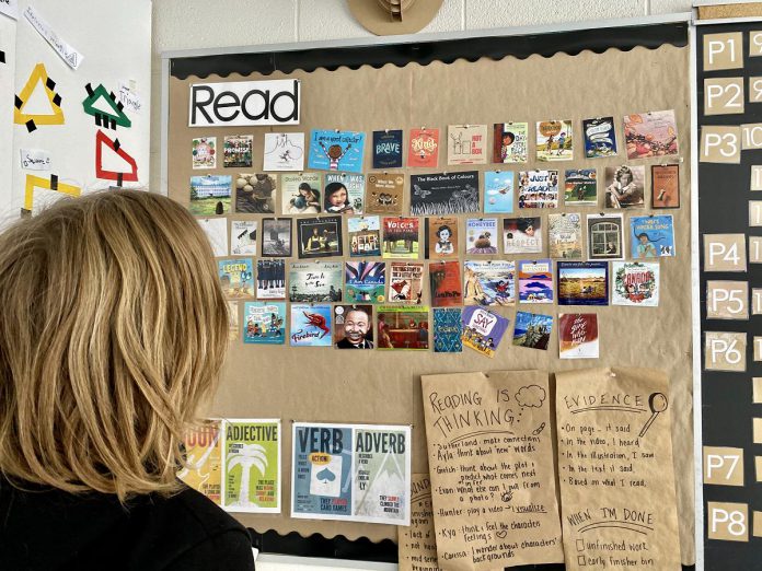 Teacher Megan Clements encourages a culture of reading among her Grade 4 and 5 students at Dr. George Hall Public School in Little Britain. She engages the students in organizing the books, displaying them, and choosing books with her for their learning goals and classroom endeavours. The students have created their own sign-up sheets to track a waiting list for the next most popular book.  (Photo: Megan Clements)