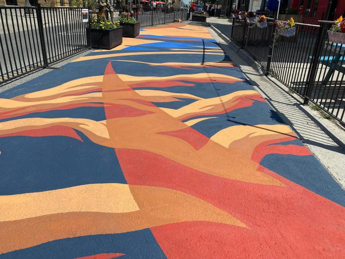 The "Glacial Formation" road mural by Josh Morley, assisted by Luke Morley, was completed on Sunday, July 10 as part of the City of Peterborough's 2022 Renaissance on Hunter initiative.  (Photo: City of Peterborough Public Art Program / Facebook)