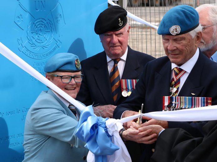 Honorary Lieutenant Colonel Lee-Anne Quinn and Major-General (retired) Lewis Mackenzie cut the ribbon for the UN Peacekeepers Monument in Peterborough's new urban park on July 1, 2022. (Photo courtesy of Sean Bruce)