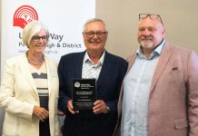 Jim Russell (right), CEO of United Way of Peterborough & District, presented the organization's 2022 Scholfield Award of Community Distinction to Katie and Jim Stewart of the Township of Otonabee South Monaghan on August 23, 2022. (Photo courtesy of United Way of Peterborough & District)