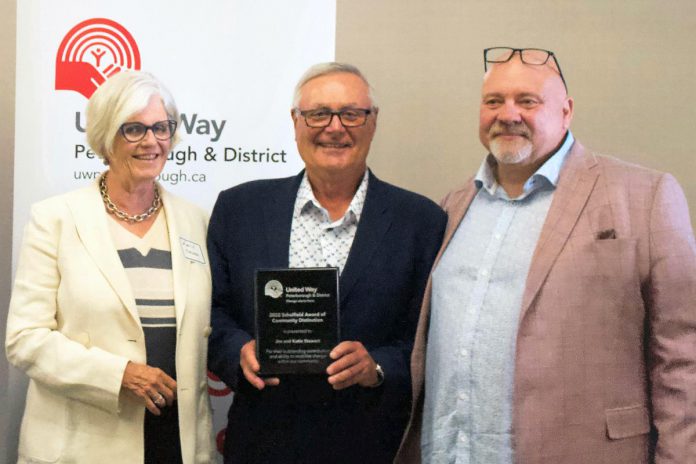 Jim Russell (right), CEO of United Way of Peterborough & District, presented the organization's 2022 Scholfield Award of Community Distinction to Katie and Jim Stewart of the Township of Otonabee South Monaghan on August 23, 2022. (Photo courtesy of United Way of Peterborough & District)