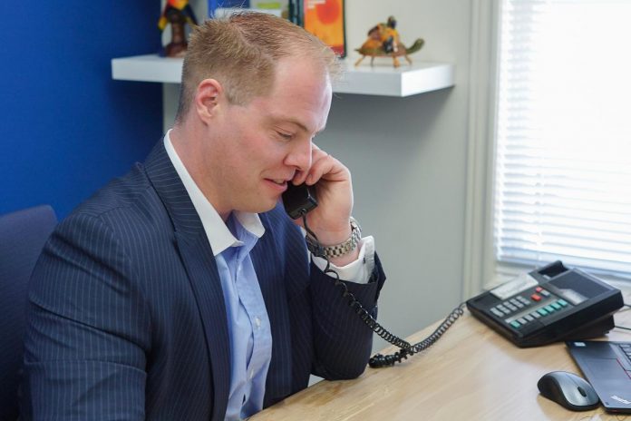 Adam McInroy at work in his office at McInroy & Associates Private Wealth Management in Bobcaygeon. As a CFP professional, Adam is held to a standard of ethics and duty to do what's in the best interests of his clients when it comes to financial planning, including retirement planning. (Photo: McInroy & Associates Private Wealth Management)