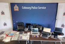 Some of the $38,000 worth of stolen laptops and tablets, government-issued identification cards, cheques, and banking and tax documents Cobourg police recovered from the vehicle of a 30-year-old Cobourg man, who faces 42 charges with more charges pending. (Police-supplied photo)