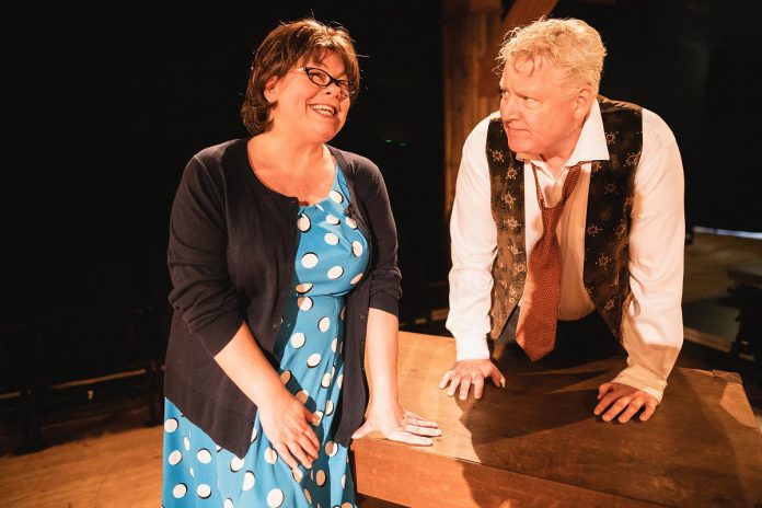 Globus Theatre founders Sarah Quick and James Barrett in a scene from Norm Foster's "Screwball Comedy."  Quick and Barrett, who also directs the play assisted by Mark Whelan, perform a cast of secondary characters.  (Photo: Rebecca Anne Bloom / Globus Theatre)