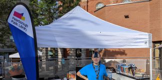 The Peterborough Public Library's "book bike" at the farmers' market. As well as encouraging literacy, environmental and otherwise, and supporting reuse by bring books to the community, the book bike is an environmentally friendly alternative to traditional gas-powered bookmobiles. (Photo courtesy of Peterborough Public Library)