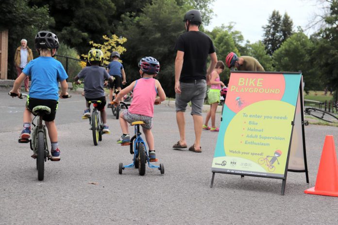 Building confidence and control on a bike can be done in all sorts of settings, but is most fun when you build in some play. Young cyclists learn to manage speed, balance, and turns as they weave through the Bike Playground at a Let's Bike event. (Photo: Jessica Todd)