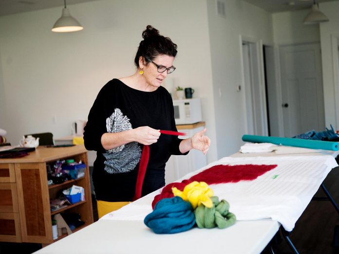 Textile artist Christianna Ferguson in her studio at 16 Bishop Street in Lakefield. Ferguson works primarily with felt as her textile of choice, because she enjoys the endless options she has when it comes to colour, texture, pattern, and form. Her studio is Tour Stop 18 on the 2022 Kawartha Autumn Studio Tour, running on September 24 and 25. (Photo courtesy of the Art Gallery of Peterborough)